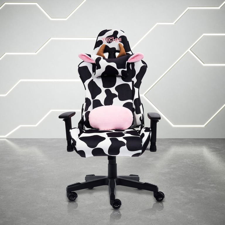 Gaming chair with cow-print black and white pattern and pink accents, featuring adjustable armrests and wheels