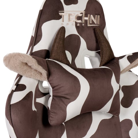 Brown and white cow print onesie pajamas with fuzzy ears and slippers, featuring a Techni Art logo on the chest